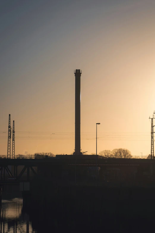 a silhouetted po of a tower in the sun