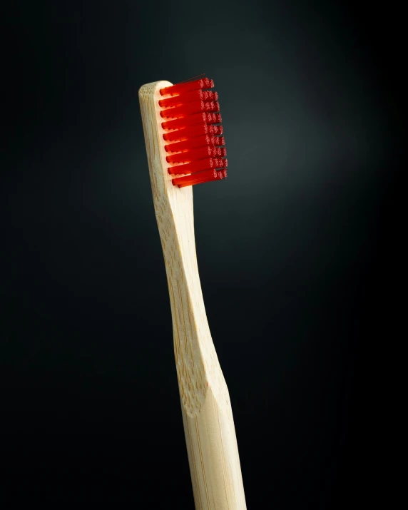 an open toothbrush with the bristles bent over