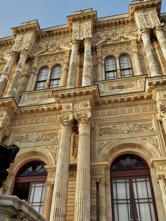 the building is very tall with large windows