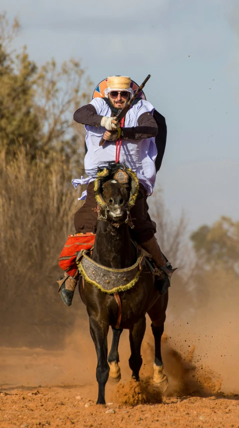 a man riding on the back of a horse with a crown