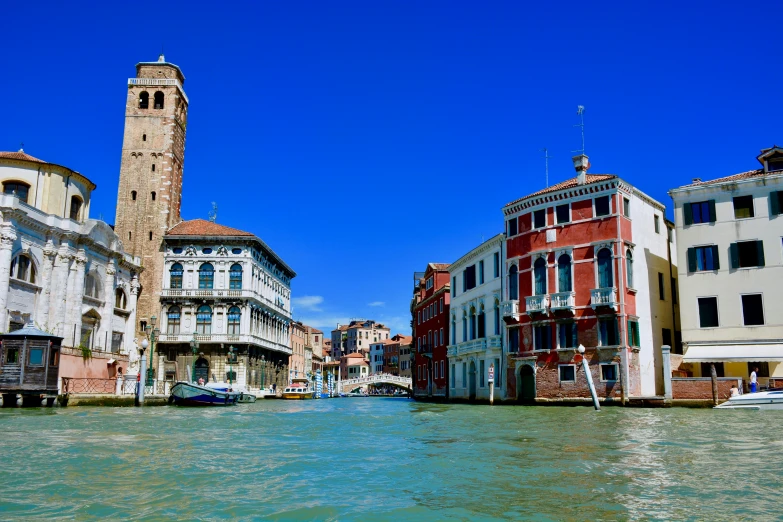 the buildings are all across the water in this canal