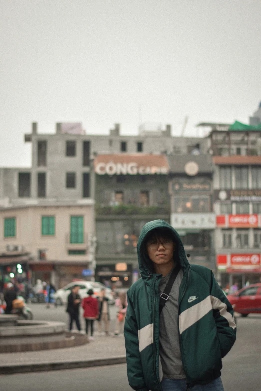 a man standing in the middle of a busy street