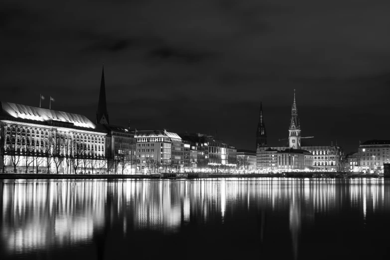 some buildings on the water water and one building