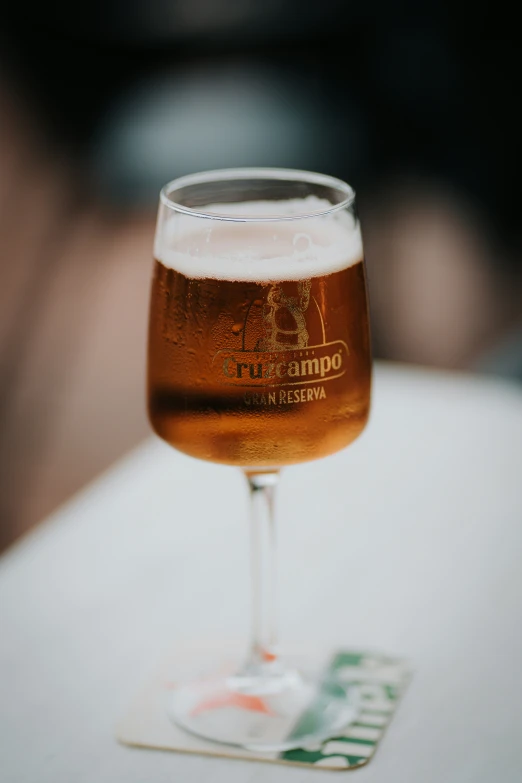 a beer glass on top of a table