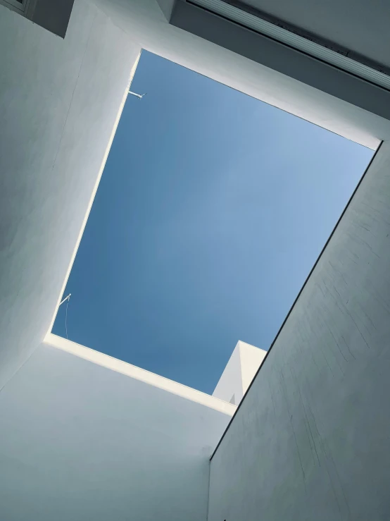 looking up at an open skylight from the floor