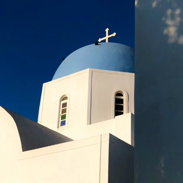 a building with a cross and a roof