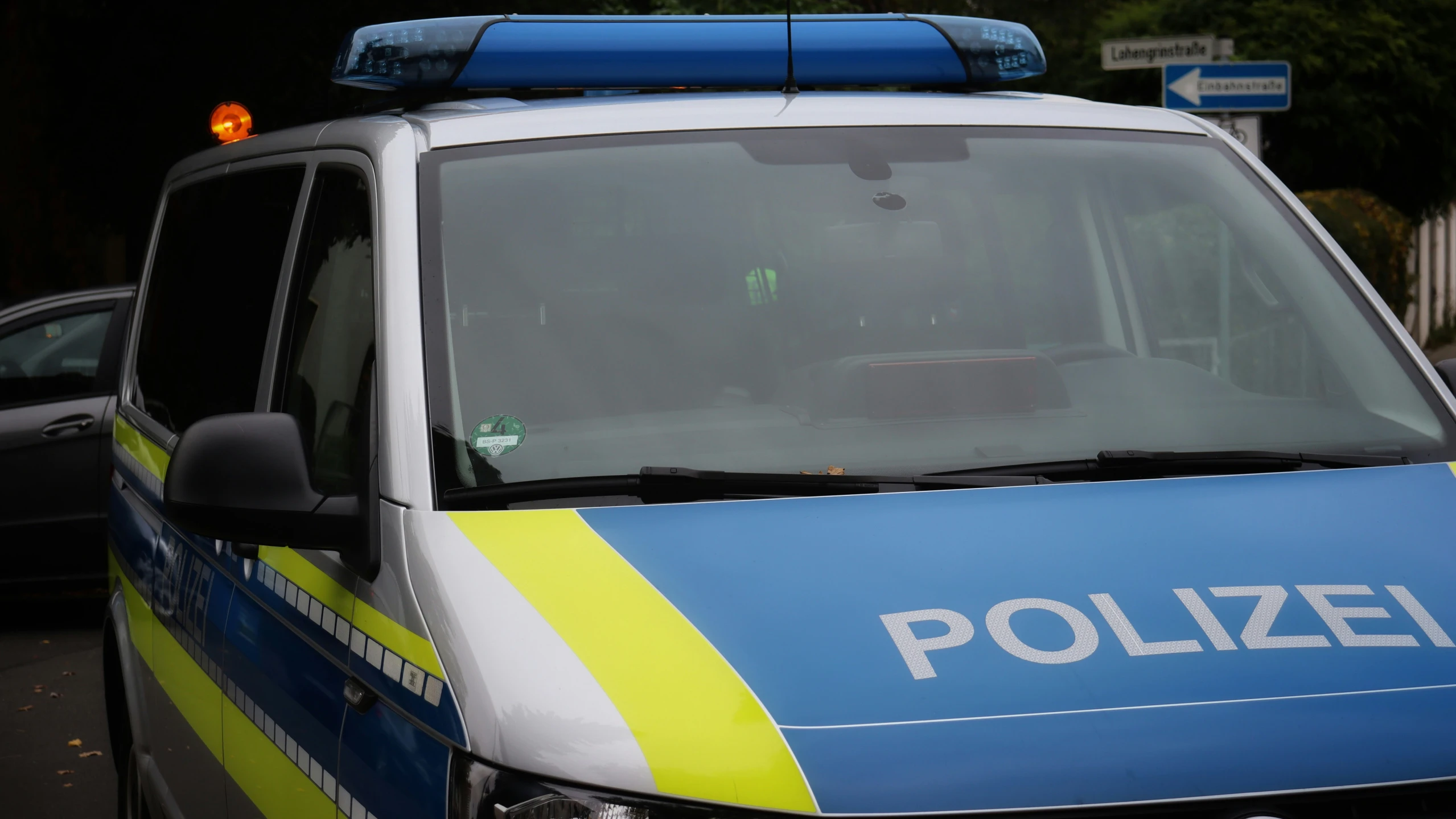 a police van sitting on the side of a road