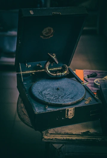 a record player set up to record in an old suitcase