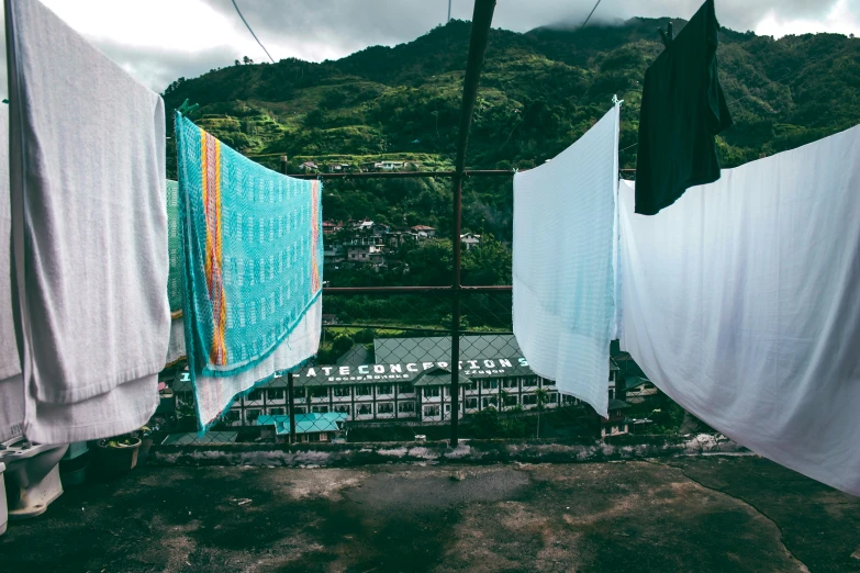 a view of laundry hanging on clothes lines