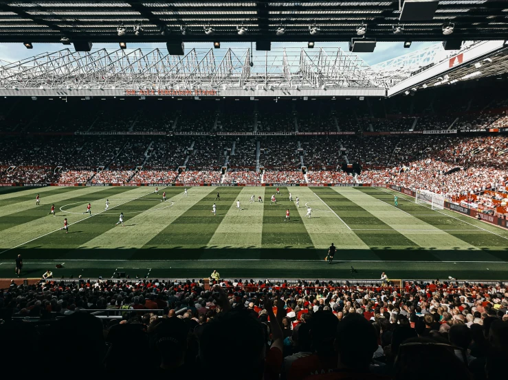 a stadium full of people watching soccer