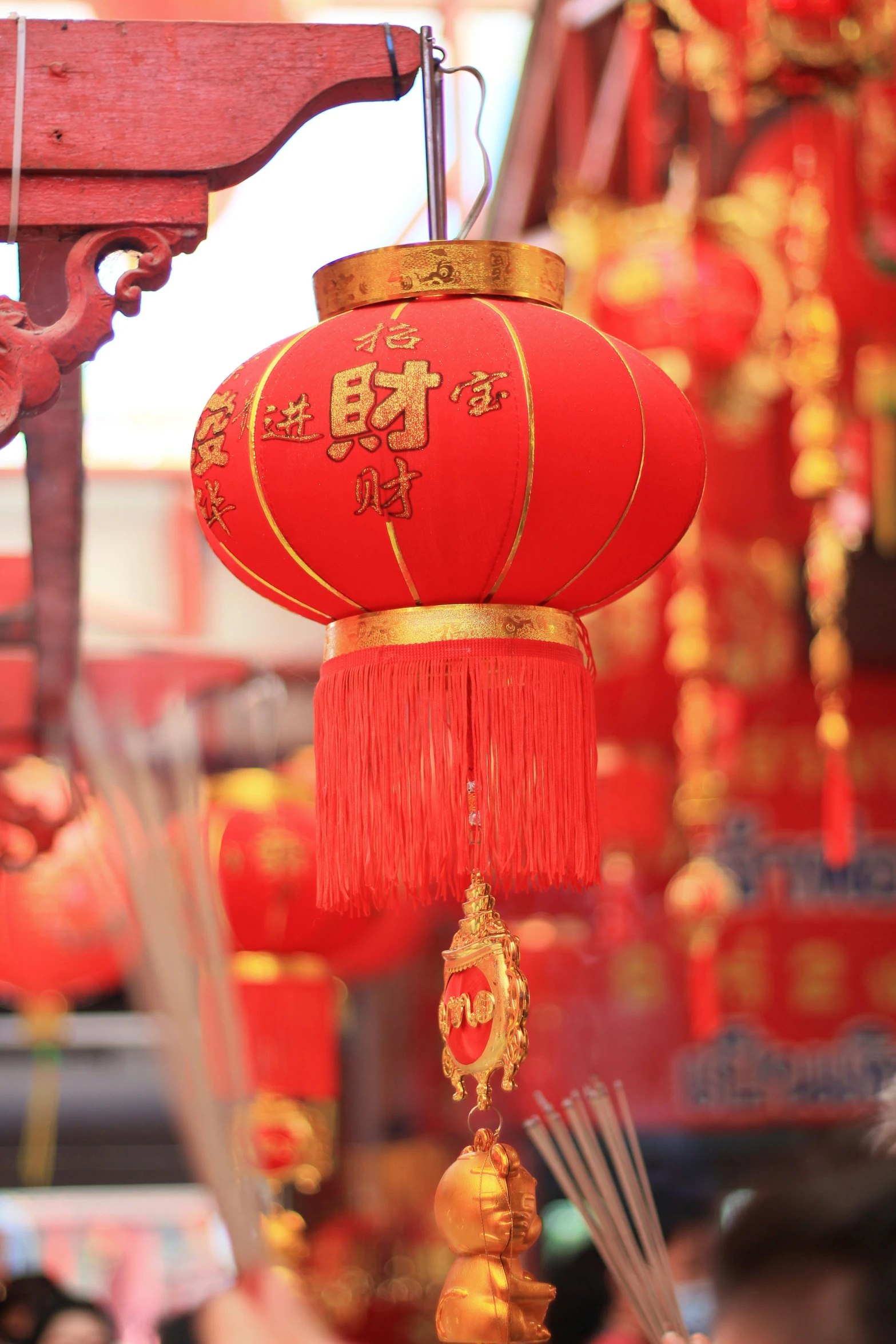 a chinese style lantern hanging from a pole