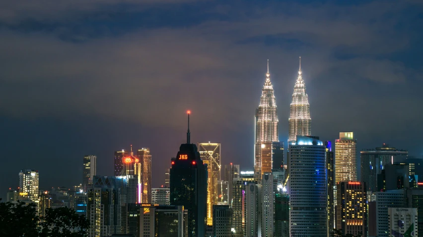 a city skyline with a blue sky and light in the background