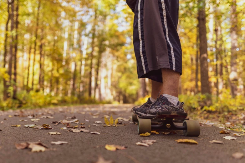 a person on a skate board riding on a trail