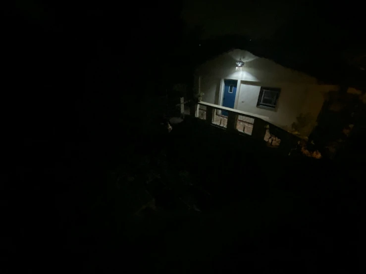 the dark outside of a house lit up at night