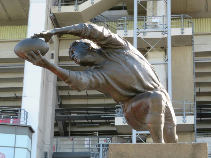 a statue in front of the ballpark and steps