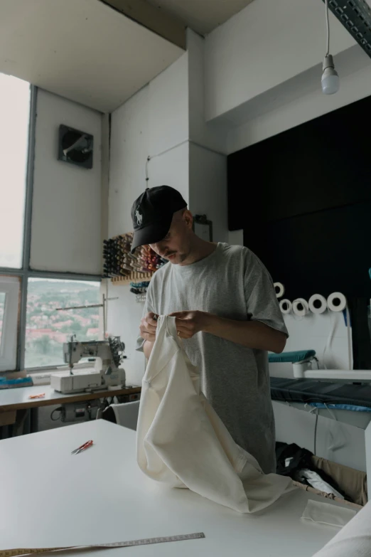 a young person standing in a kitchen with scissors