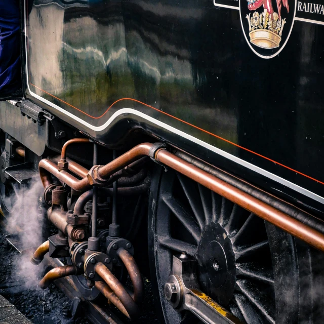 steam coming out from underneath the nose of a locomotive