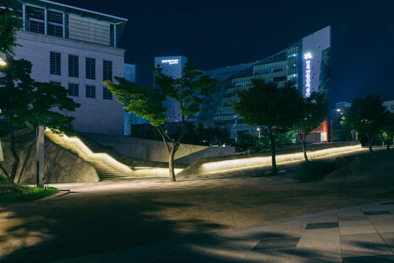a staircase made out of concrete in a park at night