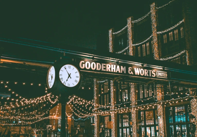 christmas lights and clocks decorate the street lights