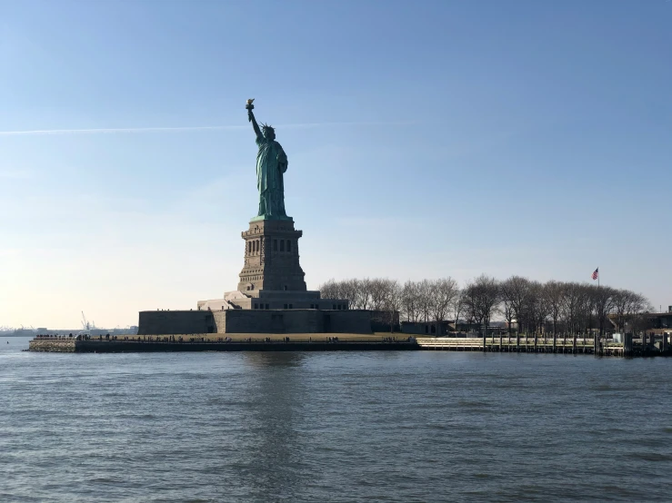 there is a statue of liberty at the waterfront