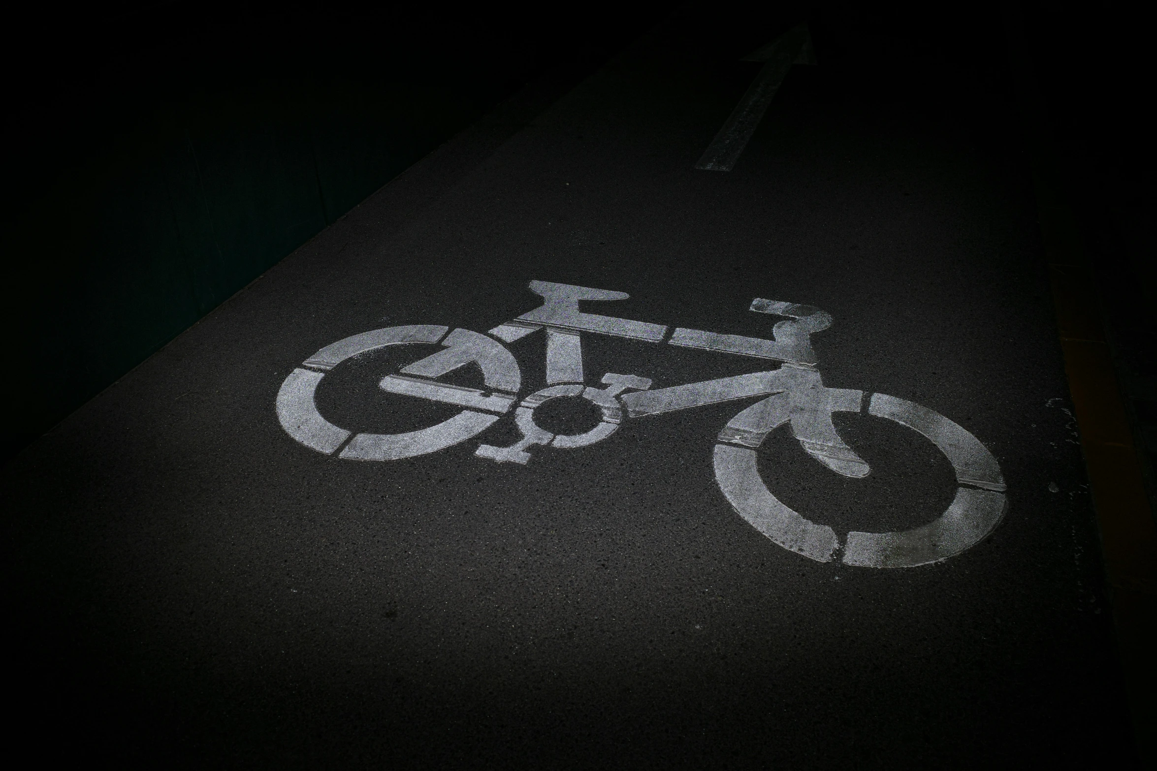 a bike path marked with white circles in a city