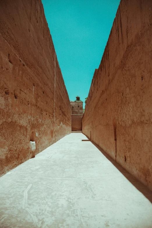 the long narrow alley has no snow on it