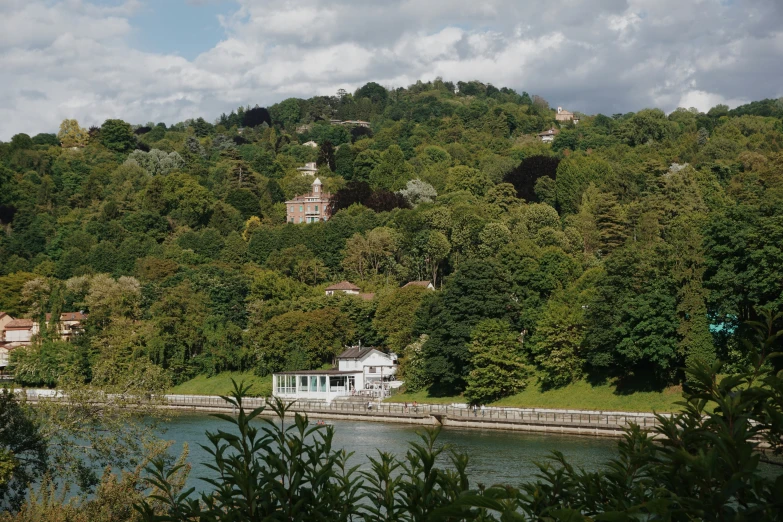 a house near a lake on a mountain