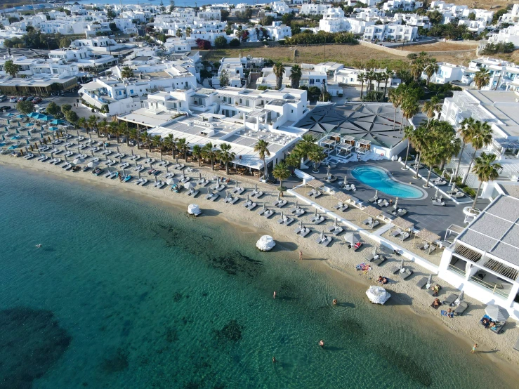 an aerial view of a small resort area near the ocean