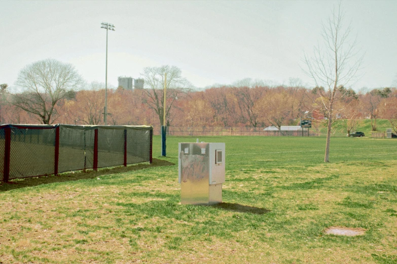 the goal post stands still in a grassy park