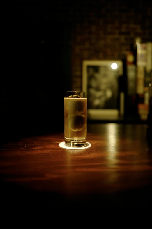 a drink sitting on top of a wooden table