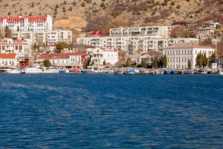 a bay in front of some very large buildings