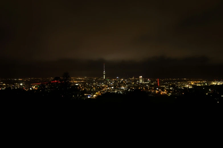 a night s of a cityscape with lights from nearby