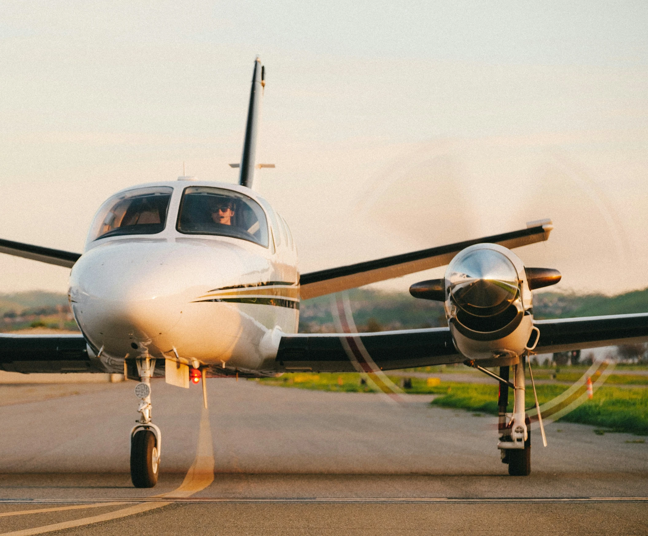 a small propeller airplane on the runway ready to take off