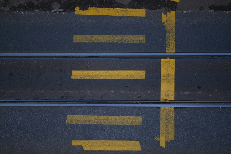 a couple of white and yellow lines in the street