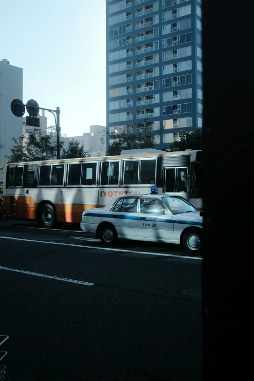 a city street filled with traffic and a bus on a street