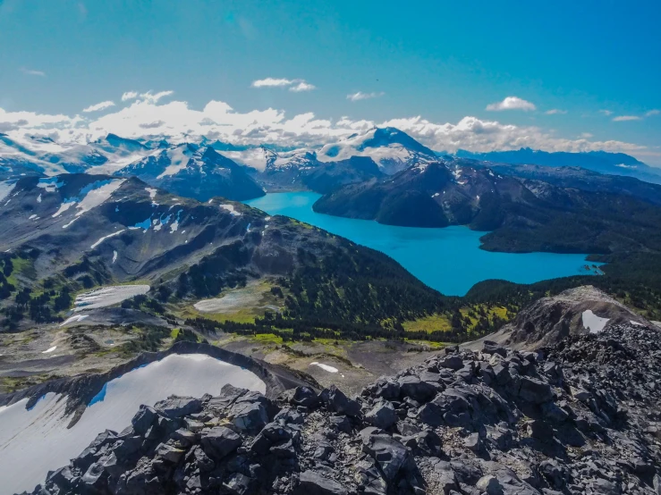 the view from an aerial point of mountains and lakes