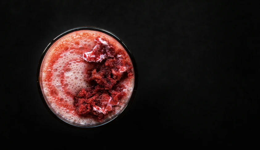 strawberrys sit in the drink being served to be consumed