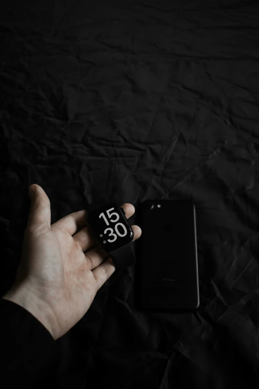 the hand is holding the dice near an iphone