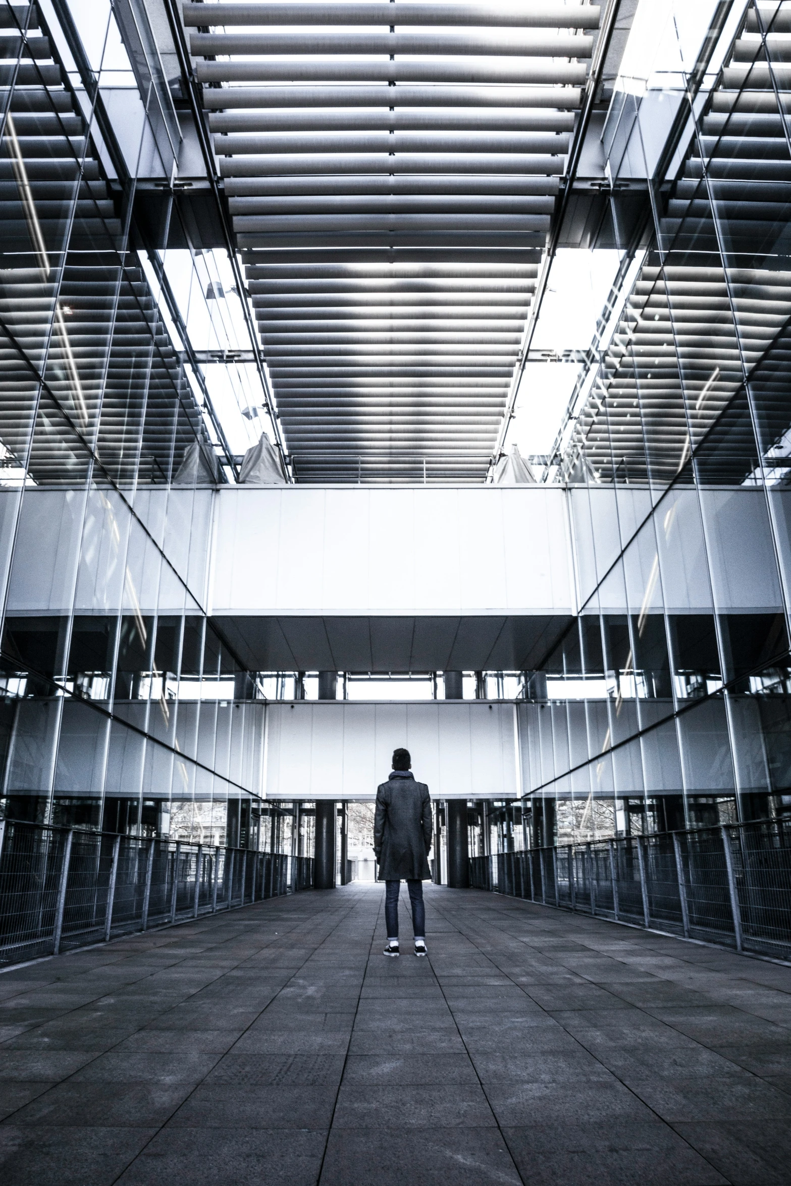 a person is looking at soing while standing in a building