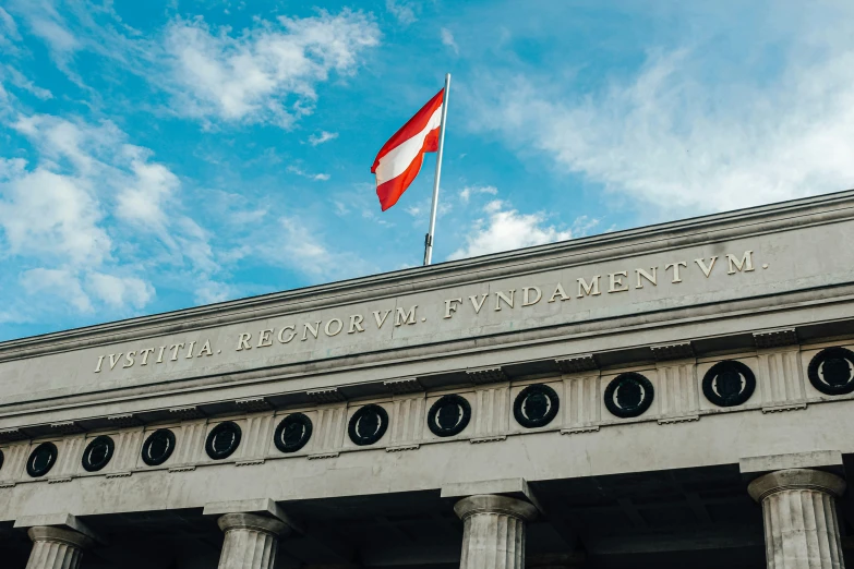 a very large building with a flag on top