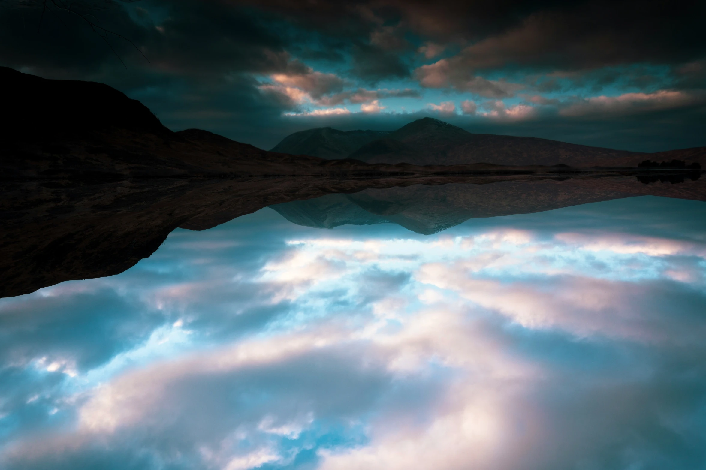 a lake is empty and surrounded by hills