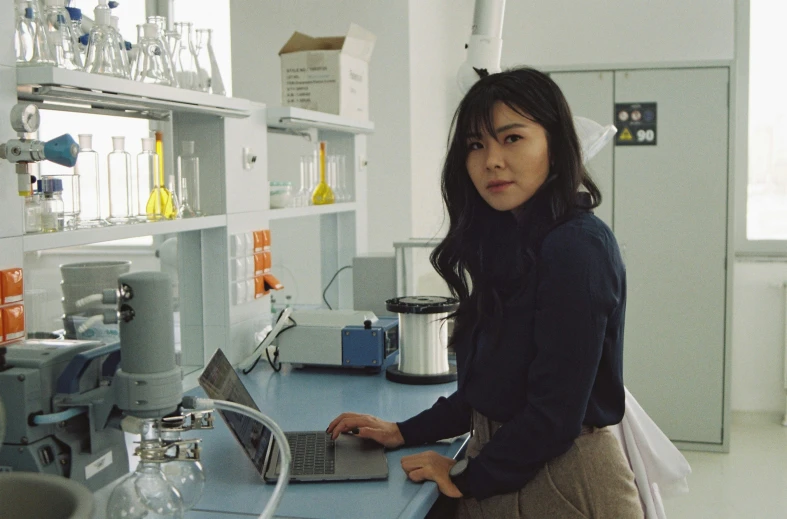 a woman standing in front of an automated machine