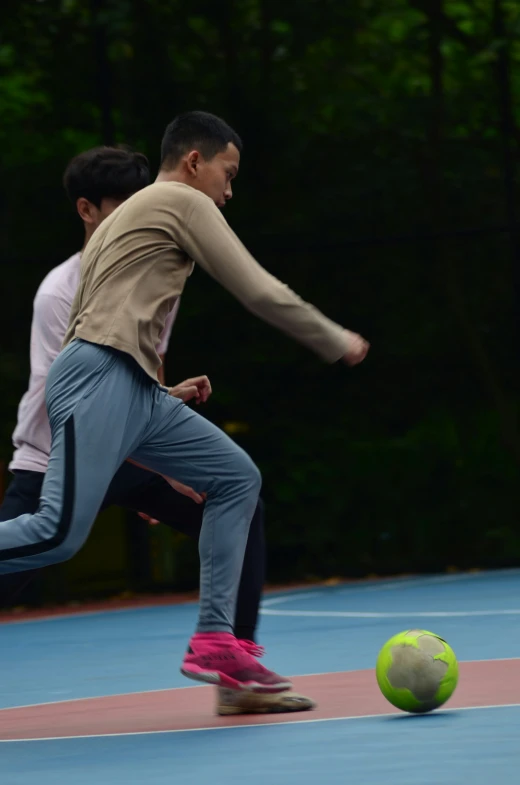 an image of a boy playing with a ball