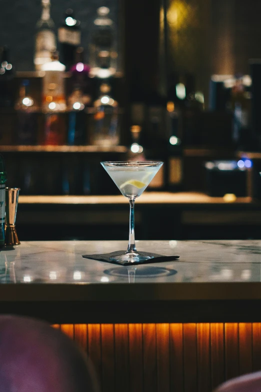 a close up of a martini at a bar