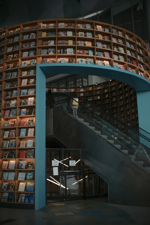 the staircase to the upper level has a very unique shelf