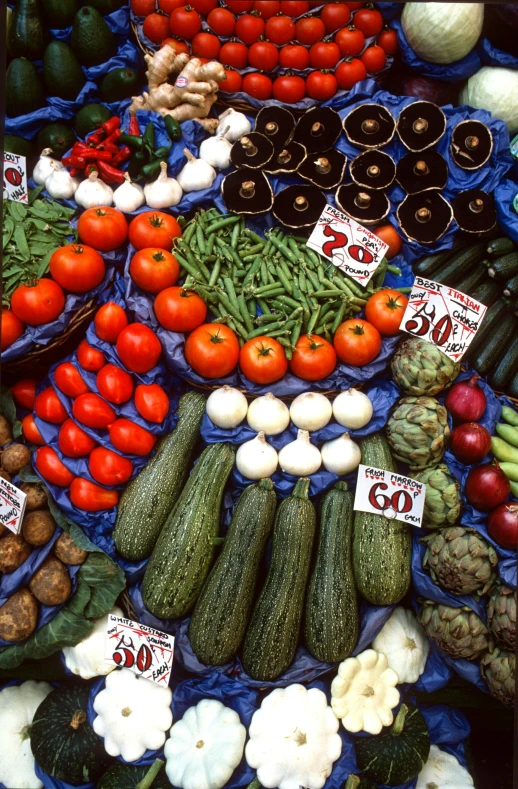 an image of a table filled with vegetables for sale