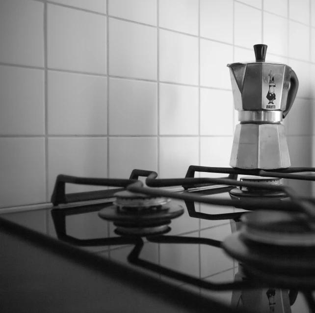 the small stove top is sitting on the counter