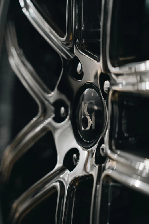 this tire is metal and shiny black and silver