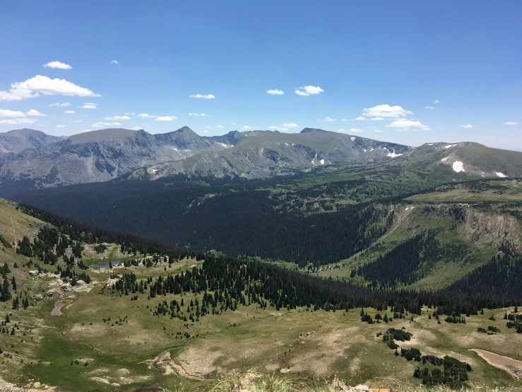 the top of a mountain with a few large hills