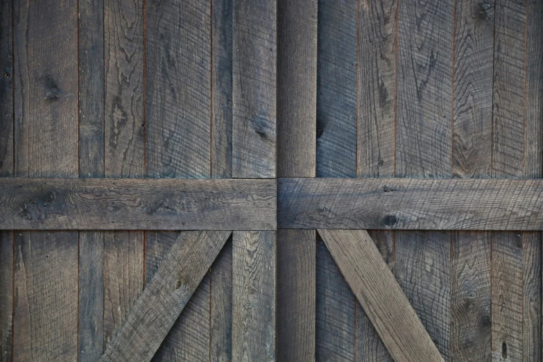 a wooden door with a couple of bars on each side